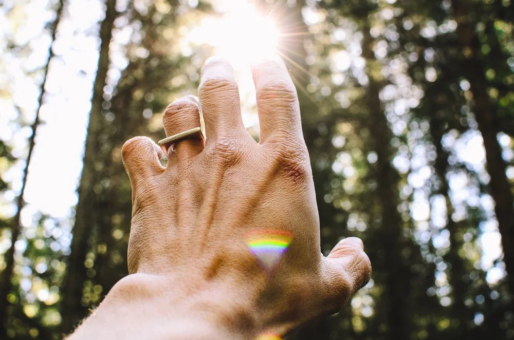 Reiki practitioner's hands hovering over a client