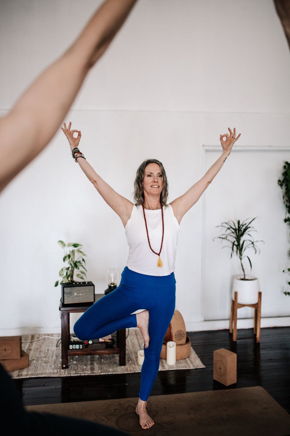 Tiffany Greene teaching tree pose in a Creation Yoga session